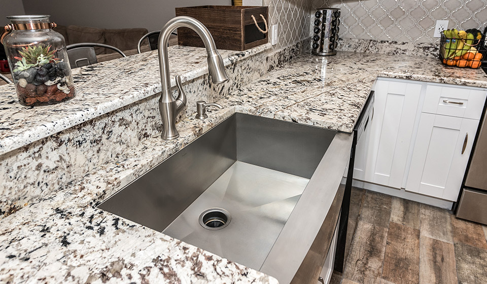 White shaker kitchen with granite countertop