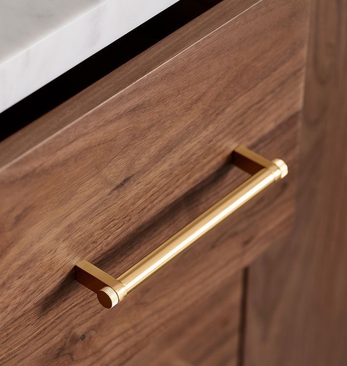 gold color cabinet hardware in modern kitchen design